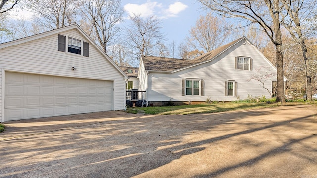 view of property exterior with a garage