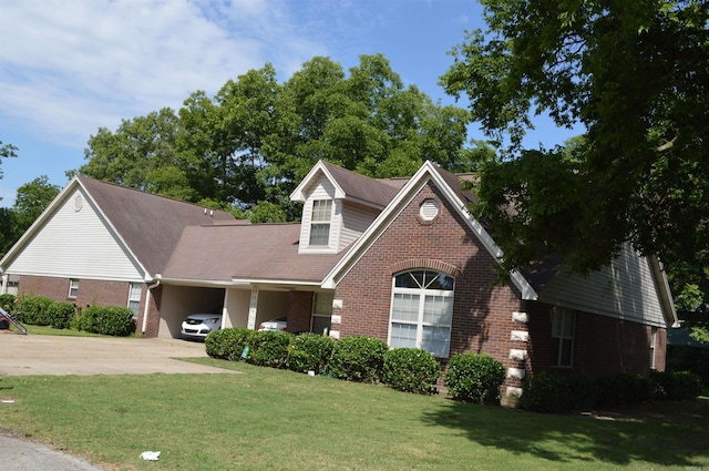 view of front facade with a front lawn and a carport