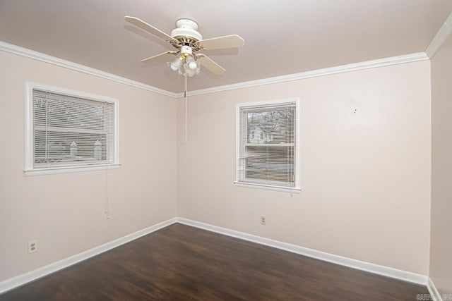 empty room featuring dark wood-type flooring, ceiling fan, and crown molding