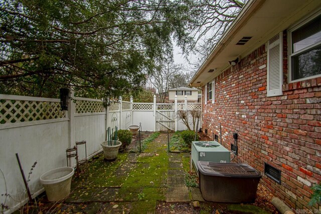 view of yard with central AC unit