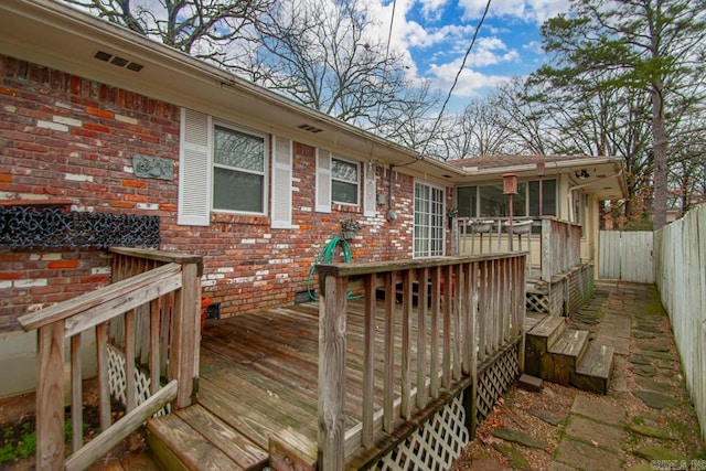 deck with a sunroom