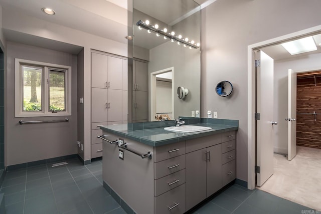 bathroom with vanity and tile patterned floors