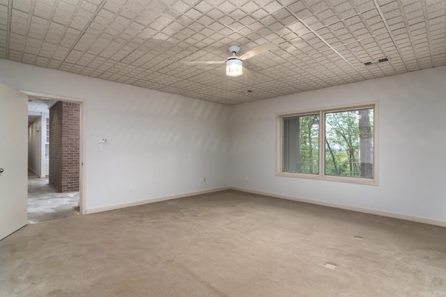 empty room with ceiling fan and carpet floors