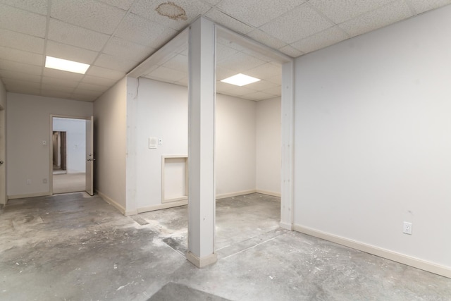 basement featuring a drop ceiling