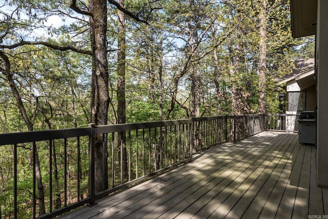 wooden terrace with a grill