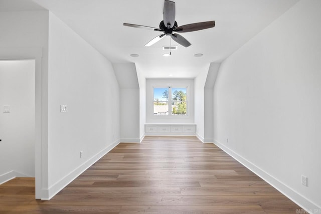 bonus room featuring ceiling fan and wood-type flooring