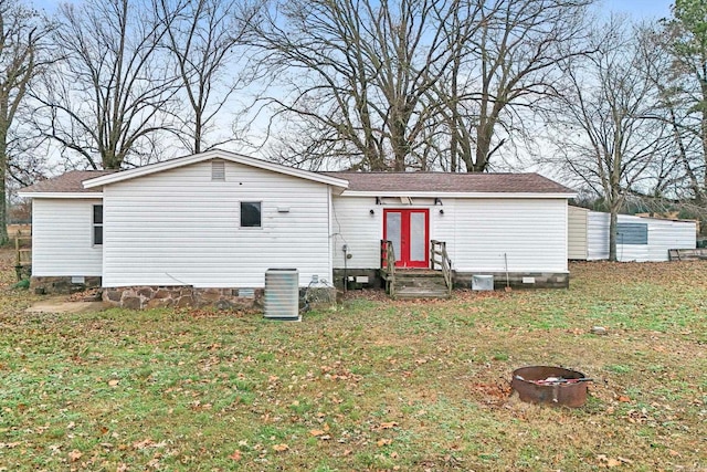 exterior space featuring a yard and central AC unit