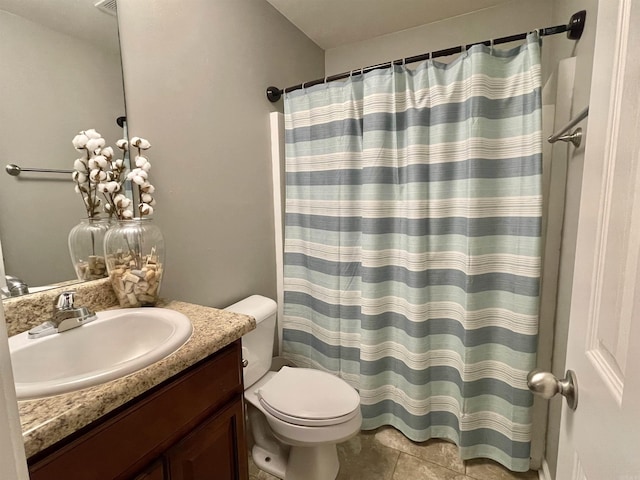 bathroom with curtained shower, tile patterned flooring, vanity, and toilet