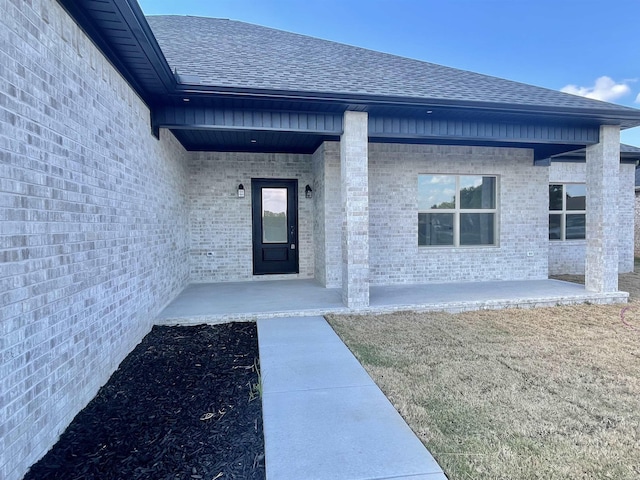 entrance to property with covered porch