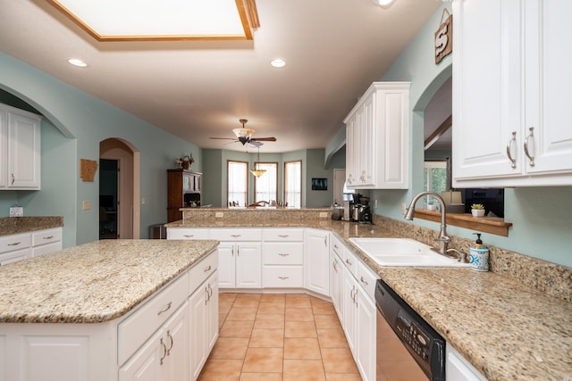 kitchen with dishwasher, white cabinets, sink, ceiling fan, and kitchen peninsula