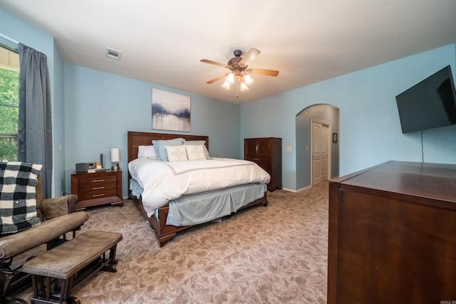 bedroom featuring ceiling fan and light colored carpet