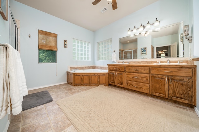 bathroom with plus walk in shower, vanity, and ceiling fan