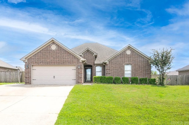 view of front facade with a garage and a front yard