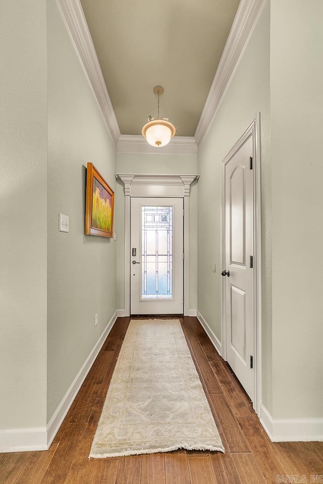 doorway featuring dark hardwood / wood-style flooring and ornamental molding