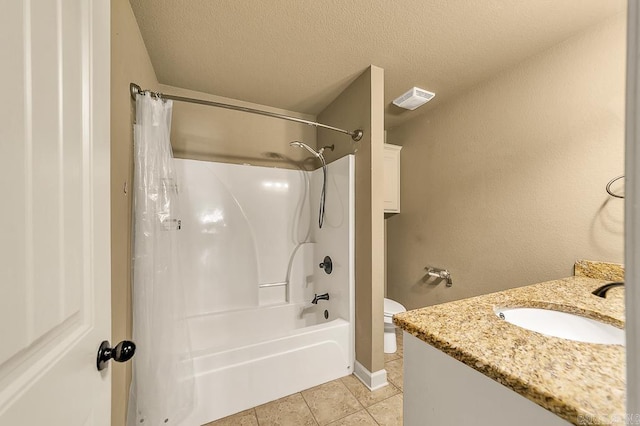 full bathroom with tile patterned floors, a textured ceiling, toilet, vanity, and shower / tub combo