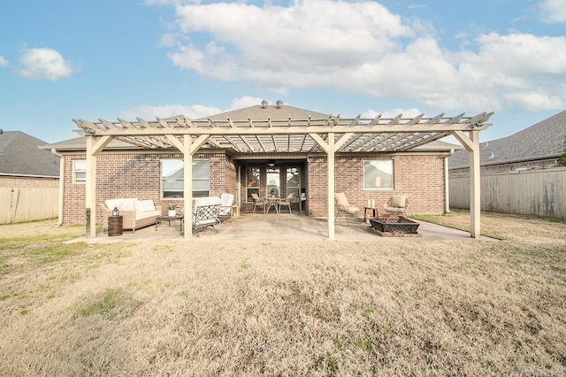 back of property with a pergola, a patio area, a lawn, and an outdoor living space with a fire pit