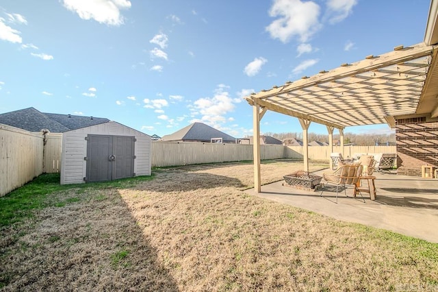 view of yard featuring a patio, a storage shed, and a pergola