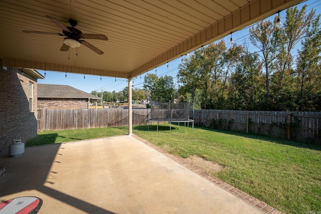 view of patio featuring ceiling fan and a trampoline