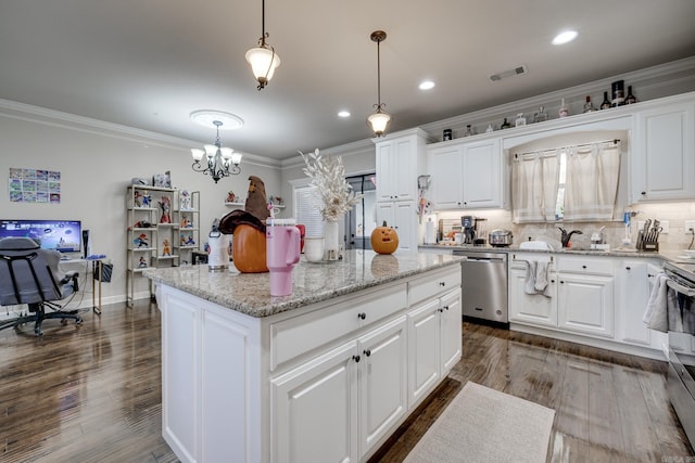 kitchen with a kitchen island, decorative light fixtures, white cabinetry, and dishwasher