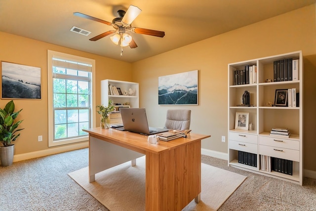 carpeted office with ceiling fan