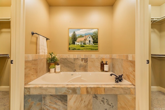 bathroom featuring tiled tub