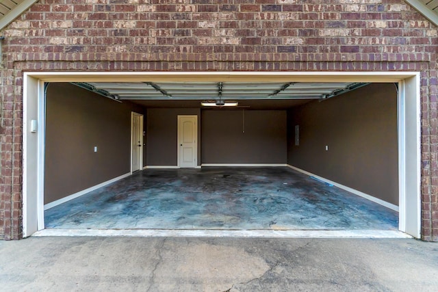 garage featuring electric panel and a carport