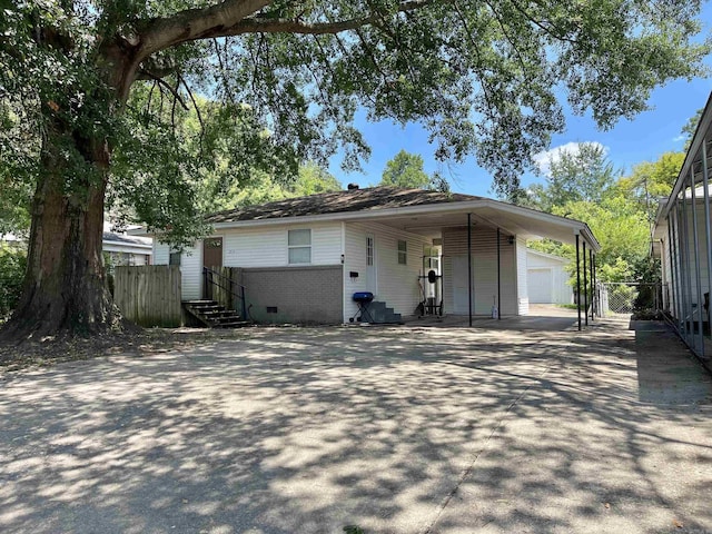 view of front of house featuring an outbuilding and a garage