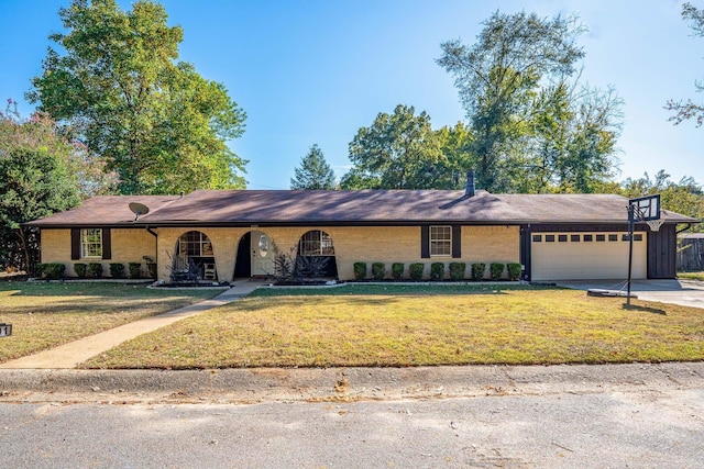 ranch-style home with a front yard and a garage