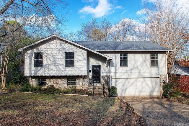 bi-level home featuring a garage