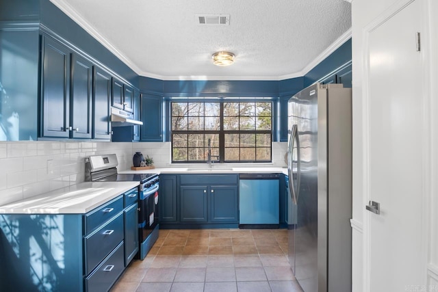 kitchen featuring blue cabinetry, appliances with stainless steel finishes, light tile patterned floors, and sink