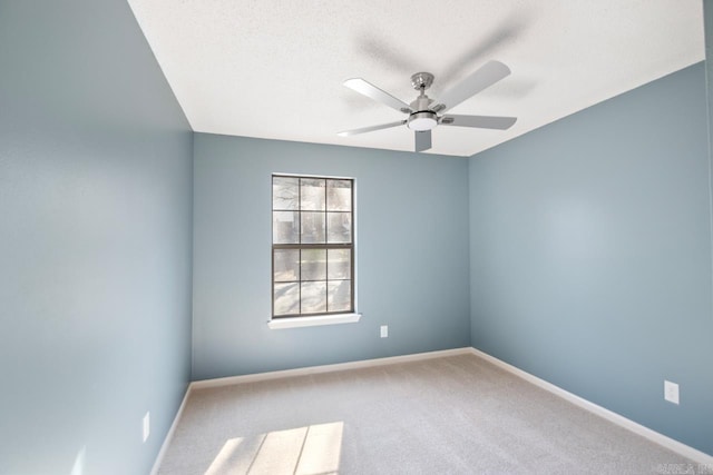 unfurnished room with carpet and ceiling fan