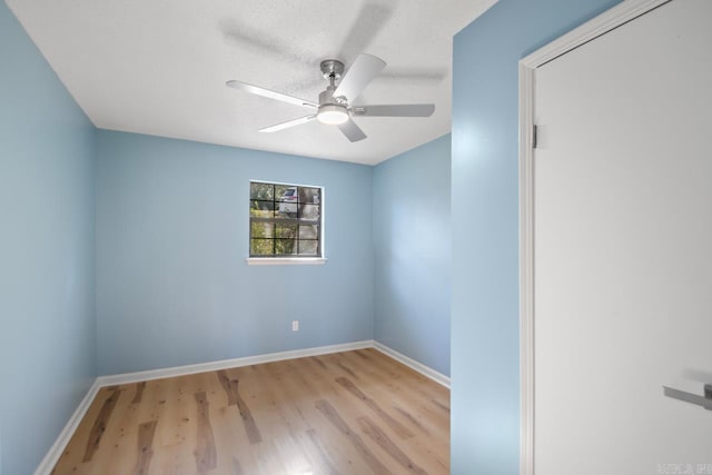 spare room with ceiling fan and light hardwood / wood-style flooring