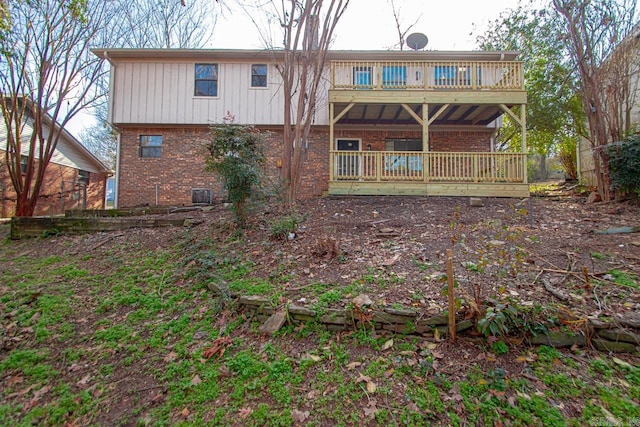 back of property with a wooden deck