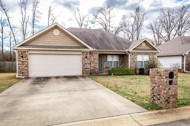 ranch-style house featuring a garage and a front lawn