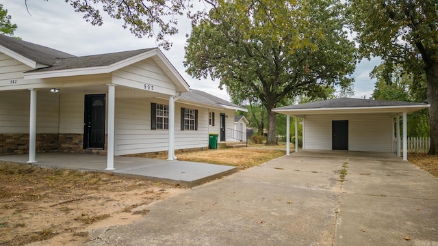 single story home with a carport