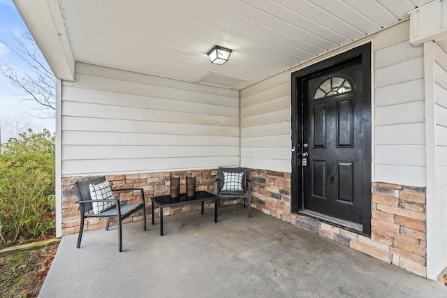 doorway to property with covered porch