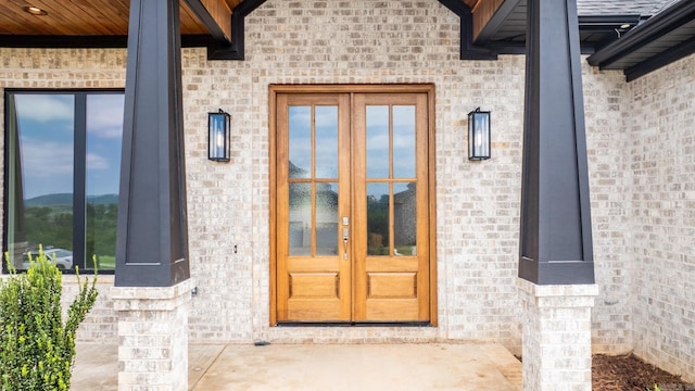 view of exterior entry featuring french doors