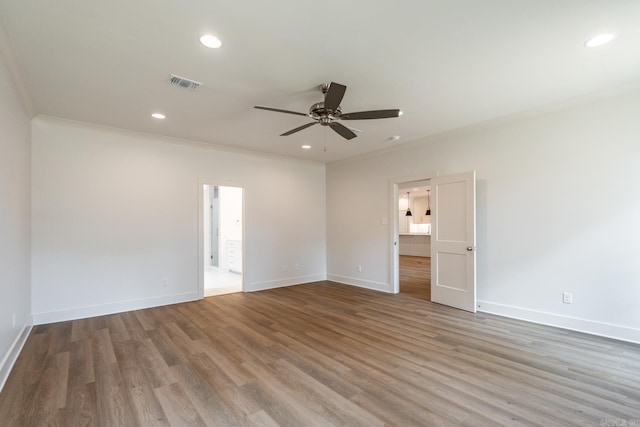 unfurnished room featuring crown molding, light hardwood / wood-style flooring, and ceiling fan