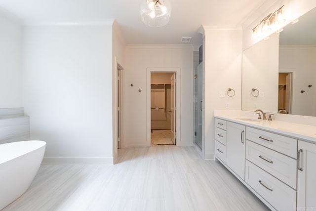 bathroom featuring plus walk in shower, vanity, and ornamental molding