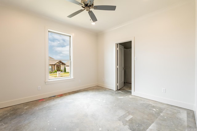 unfurnished room with ceiling fan and crown molding