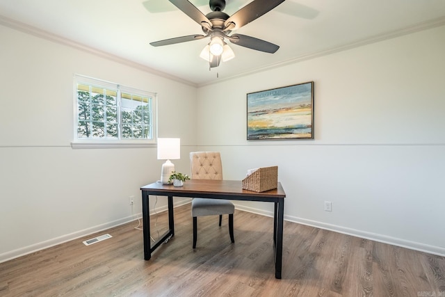 office with hardwood / wood-style flooring, ceiling fan, and ornamental molding