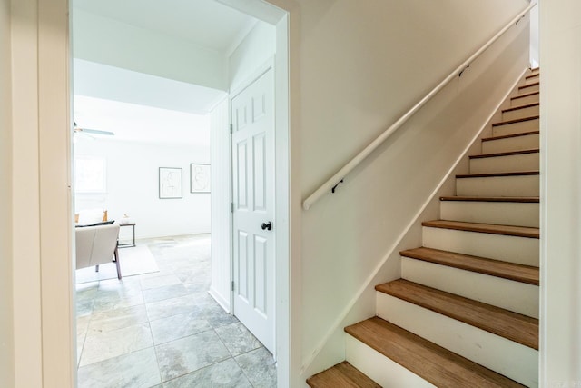 stairs with ceiling fan