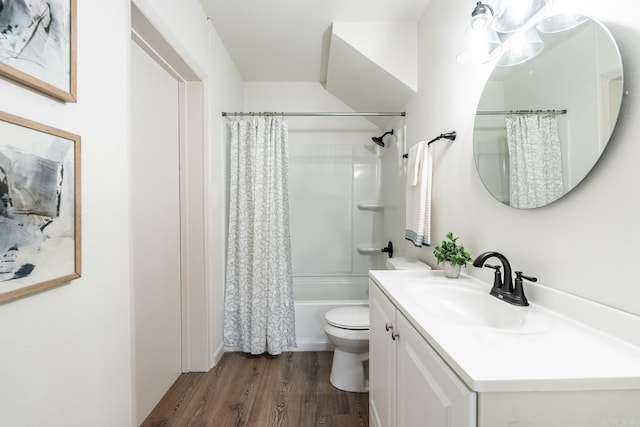 full bathroom with hardwood / wood-style floors, vanity, shower / bath combination with curtain, and toilet