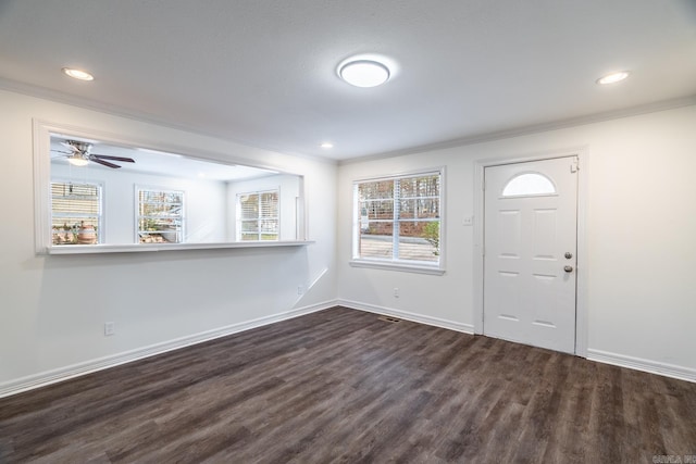 entrance foyer with dark hardwood / wood-style flooring, ceiling fan, and ornamental molding