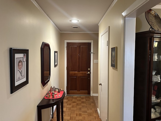 doorway with parquet flooring and ornamental molding