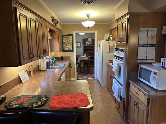 kitchen with crown molding, sink, light tile patterned floors, and white appliances