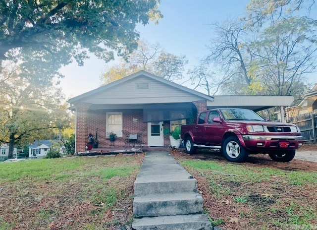 bungalow-style home featuring a carport