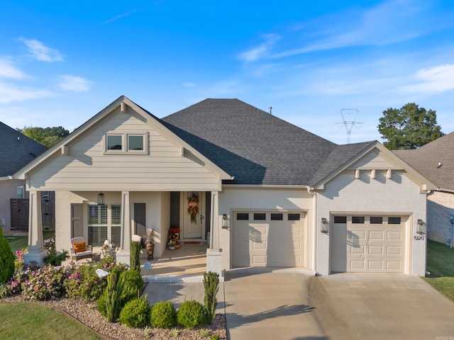 view of front facade with a porch and a garage