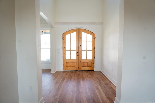 entrance foyer with french doors and hardwood / wood-style flooring