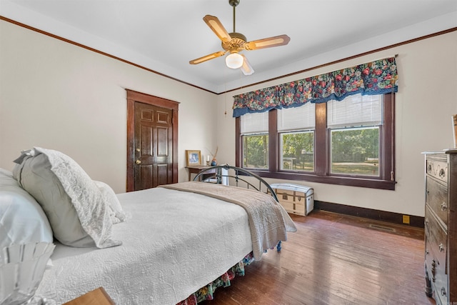 bedroom with ceiling fan and dark hardwood / wood-style flooring